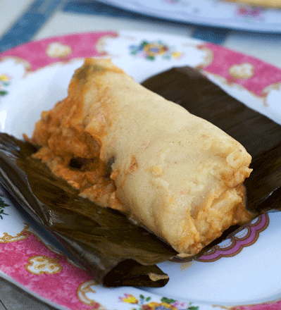 A Salvadoran Tamale prepared on banana leaves A Salvadoran Tamale prepared on banana leaves