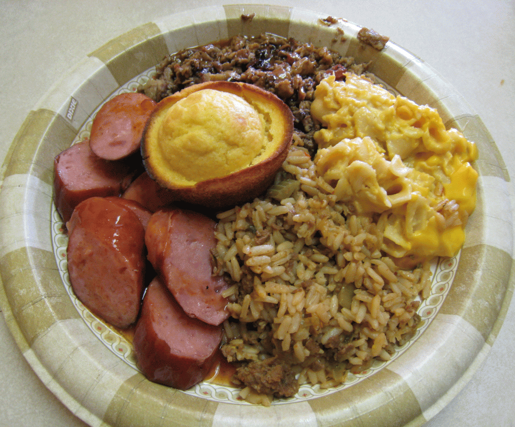 Smoked sausage and brisket with dirty rice and macaroni and cheese