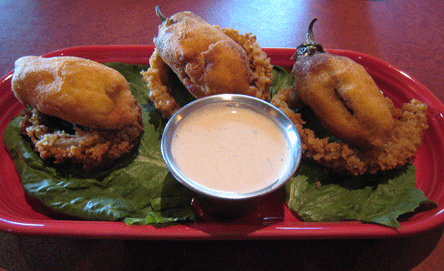 Rodeo Rellenos Spicy jalapeños stuffed with cream cheese, bacon — served with Buttermilk Onion Rings & cool, creamy dip